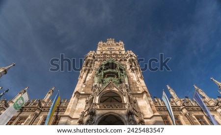 Clock Tower or Glockenspiel close-up, section of bell play timelapse, Munich, Germany. Looking up perspective. Detail of Rathaus New Town Hall with chime in city center. Located on Marienplatz square Royalty-Free Stock Photo #2425483547