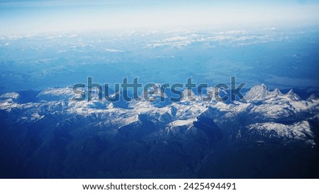 Spectacular panoramic views to see Grand Tetons on the flight. Different Angle to see such mountain ranges. Grand Teton National Park, Wyoming.    Royalty-Free Stock Photo #2425494491