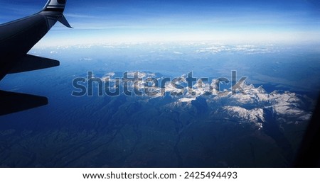 Spectacular panoramic views to see Grand Tetons on the flight. Different Angle to see such mountain ranges. Grand Teton National Park, Wyoming.    Royalty-Free Stock Photo #2425494493