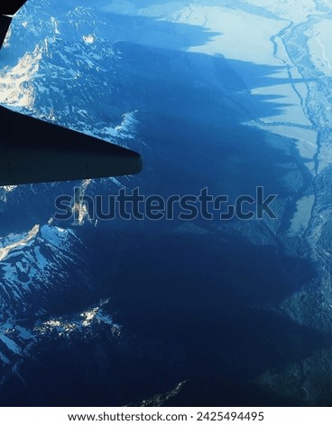 Spectacular panoramic views to see Grand Tetons on the flight. Different Angle to see such mountain ranges. Grand Teton National Park, Wyoming.    Royalty-Free Stock Photo #2425494495