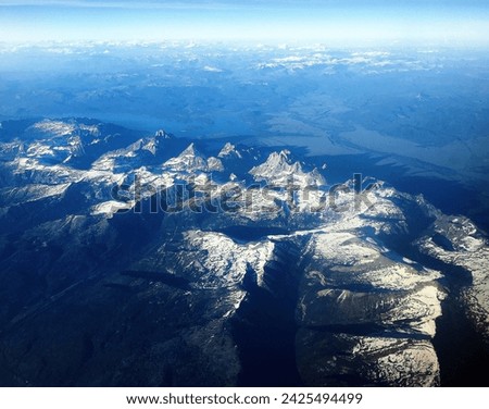 Spectacular panoramic views to see Grand Tetons on the flight. Different Angle to see such mountain ranges. Grand Teton National Park, Wyoming.    Royalty-Free Stock Photo #2425494499