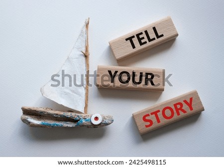 Tell your story symbol. Wooden blocks with words Tell your story. Beautiful white background with boat. Business and Tell your story concept. Copy space.