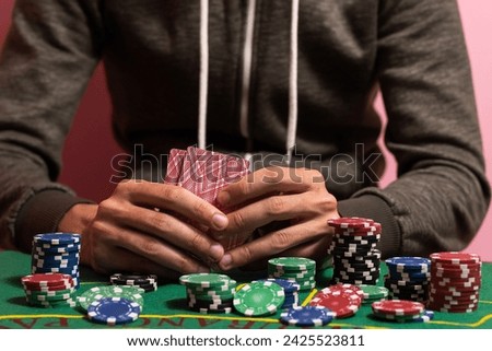 The player makes a bet in poker. Royalty-Free Stock Photo #2425523811