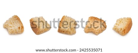 Set of croutons of wheat bread isolated on a white background with shadows. High resolution detail macro shot with focus stacking composed of several images