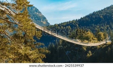 Alpine summer view at the famous Highline 179 suspension bridge and the Ehrenberg castle ruins near Reutte, Tyrol, Austria Royalty-Free Stock Photo #2425539937