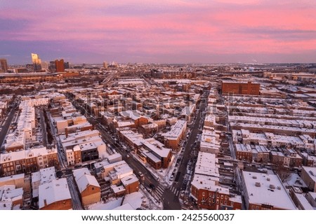 Aerial Drone View of Baltimore City Skyline with Snow Covered Houses at Sunset