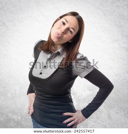 Young girl doing a joke over textured background 
