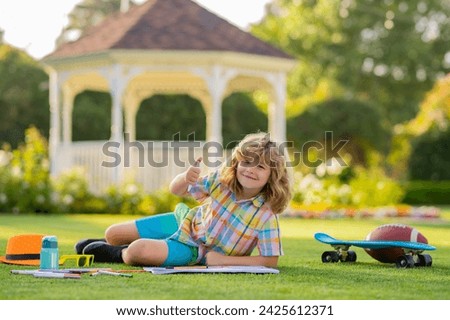 Summer kids leisure. School kid drawing in summer park, painting art. Little painter draw pictures outdoor. Happy child playing outside. Drawing summer theme.