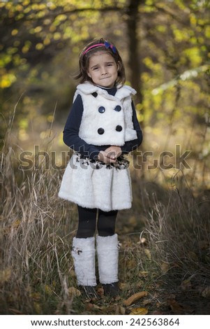 Portrait of a little girl in park