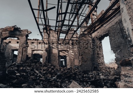 inside a damaged house war in Ukraine Royalty-Free Stock Photo #2425652585