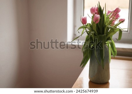 Beautiful pink tulips in a vase. Flowers