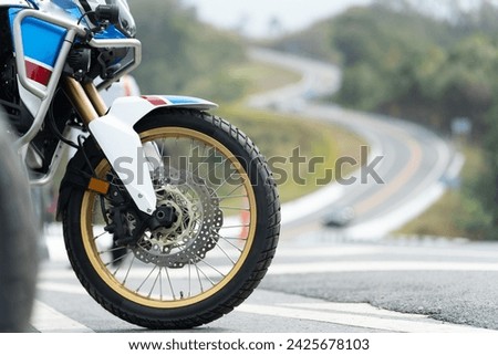 Motorcycle in a sunny motorbike on the road riding.with sunset light. copyspace for your individual text.On the road.	 Touring Bike motorcycle.	 Royalty-Free Stock Photo #2425678103
