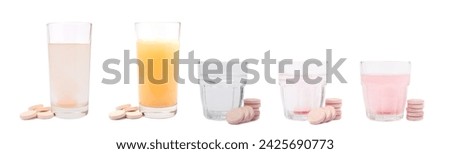 Vitamin C effervescent tablets with orange flavor drops and dissolves in a glass of water isolated on a white background. The concept of health. Medicine concept.