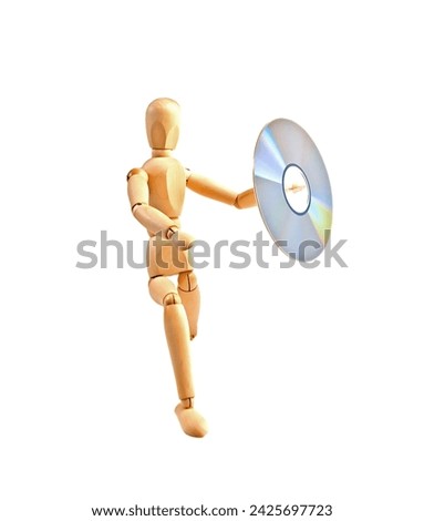 wood mannequin with CD-rom on white background Royalty-Free Stock Photo #2425697723