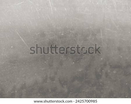 Black plastic background with scratches, broken plastic texture.
