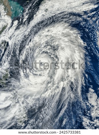 Typhoon Lan. The storm was expected to intensify significantly and might make landfall on the Japanese mainland. Elements of this image furnished by NASA. Royalty-Free Stock Photo #2425733381