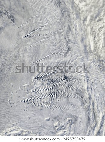 Shipwaveshape wave clouds induced by South Sandwich Islands. Shipwaveshape wave clouds induced by South Sandwich Islands. Elements of this image furnished by NASA. Royalty-Free Stock Photo #2425733479