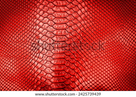 Red snake skin texture pattern can see the surface details use for background
