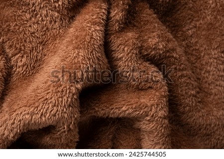 Texture of a brown faux fur as a background. 
