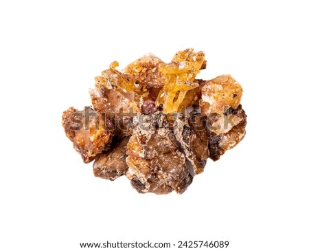 Pile of spruce tree Picea abies resin pieces, isolated on white background. Using spruce resin in medicine and beauty industry concept. Flat lay studio shot. Royalty-Free Stock Photo #2425746089