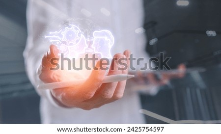 Ai Digital transformation technology strategy transformation of ideas and the adoption of technology, enhancing global business capabilities Businessman holding virtual ai icon, blurred background 