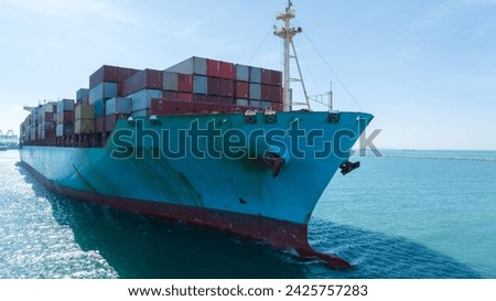 front view Cargo Container ship in the ocean ship carrying container and running for import export concept technology freight shipping by ship
