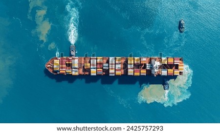 Cargo Container Ship was pulling by Tugboat. container ship import export to customers sea port. export shipping industry freight and transportation logistics concept. 