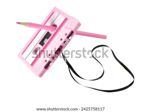 Cassette tape with pencil isolated on white background