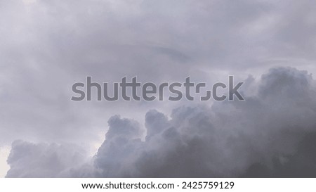 The view of the dark city sky with thick clouds and dark colors indicates bad weather with the potential for rain or storms