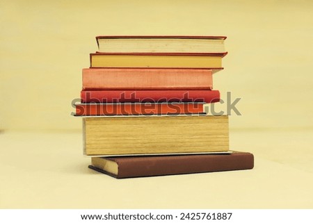 stack of books on a wooden table. high quality photo