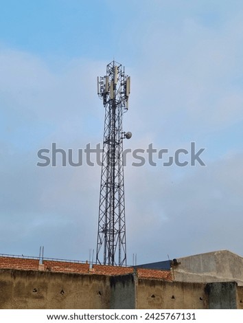 Picture of Base Transceiver Station with blue sky background and white clouds in the morning