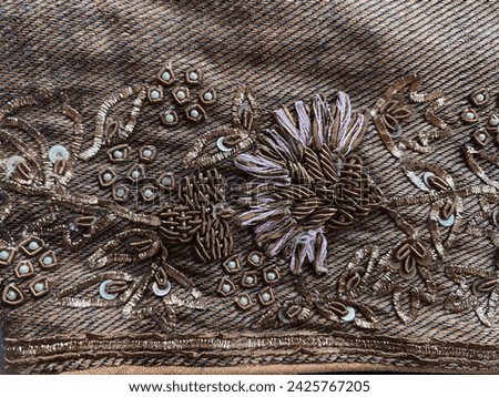 Antique golden zardozi floral embroidery on golden diagonal woven silk fabric