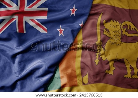 big waving national colorful flag of sri lanka and national flag of new zealand . macro Royalty-Free Stock Photo #2425768513