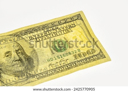 fragment of 100 dollar banknote with visible details of banknote reverse for design purpose. Franklin watermark on 100 bill