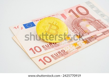 bitcoin to euro, crypto concept. Bitcoin in Europe. photo of golden bitcoins new virtual currency with traditional dollars and euro as a background .
