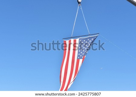 American flag in a blue sky
