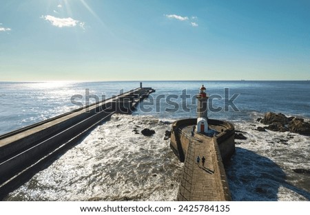 Beacon of the Shore: A Majestic Lighthouse Adorns the Pier, Overlooking the Vast Ocean in Foz Do Douro, Porto Royalty-Free Stock Photo #2425784135
