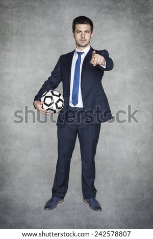 Football manager pointing at you