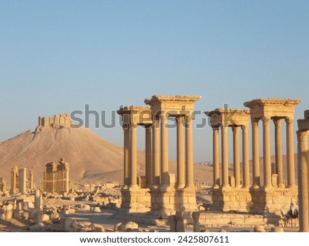 The Bel Temple in Palmyra, Syria, is an ancient architectural marvel. Majestic columns and intricate carvings adorn its facade, reflecting a blend of Roman and Semitic influences. The temple, dedicate Royalty-Free Stock Photo #2425807611