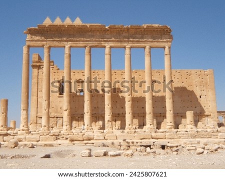 The Bel Temple in Palmyra, Syria, is an ancient architectural marvel. Majestic columns and intricate carvings adorn its facade, reflecting a blend of Roman and Semitic influences. The temple, dedicate Royalty-Free Stock Photo #2425807621