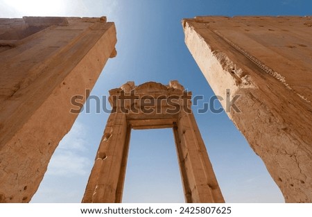 The Bel Temple in Palmyra, Syria, is an ancient architectural marvel. Majestic columns and intricate carvings adorn its facade, reflecting a blend of Roman and Semitic influences. The temple, dedicate Royalty-Free Stock Photo #2425807625
