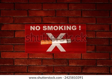No Smoking Sign on red Brick Wall