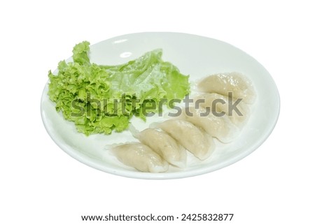 khanom Pang Sib Thai snack made from steamed flour stuffing mashed fish eating with fresh lettuce on plate Royalty-Free Stock Photo #2425832877