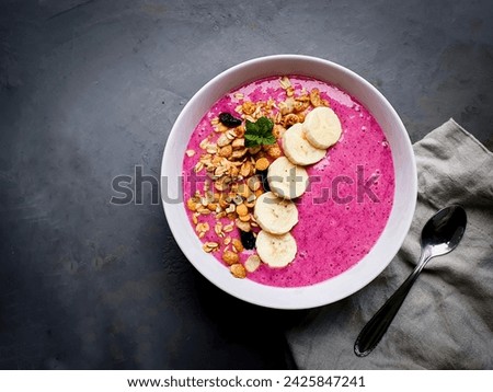 pink dragon fruit , pitaya smoothie in white bowl and  gray background with space for text