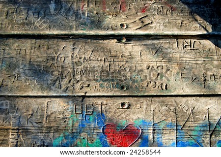 Carved Graffiti planks with oblique lighting Royalty-Free Stock Photo #24258544
