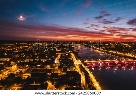 Luminescent Tapestry: Captivating Aerial View of Blois, Loir-et-Chers Glittering Night Cityscape