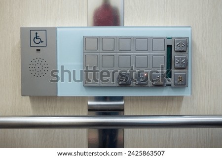 braille signage on elevator buttons on the wooden wall. elevator buttons with number and braille letter for an accessible.