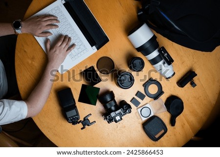 photographer workplace, camera and accesories, working on the laptop-2