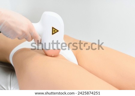 laser hair removal. Woman on laser hair removal treatments thighs and bikini area.