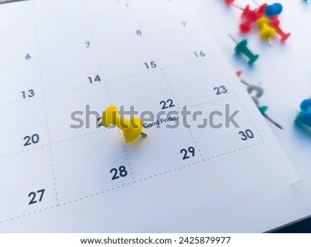 Good Friday march with push pins on calendar Royalty-Free Stock Photo #2425879977